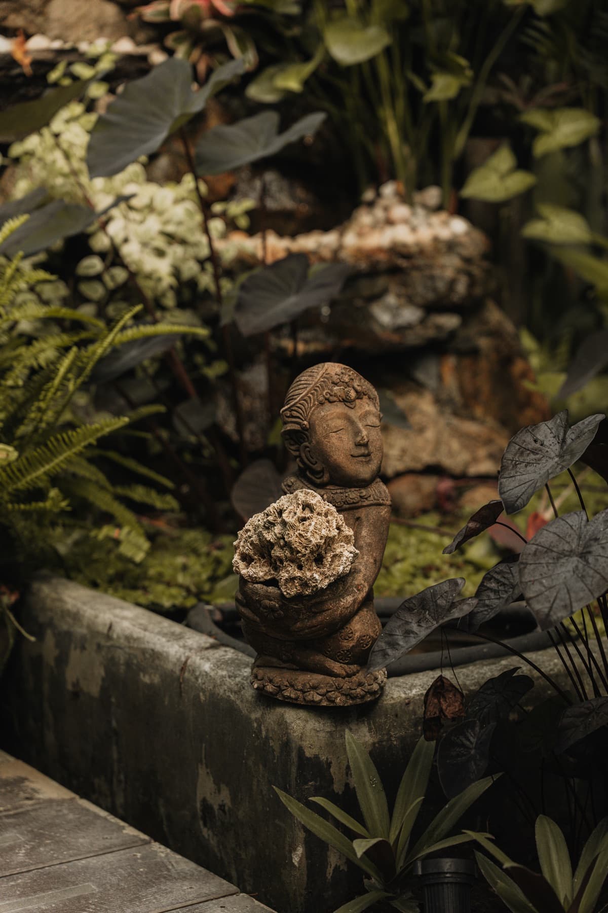 Thai stone goddess statue in the Wonderland garden