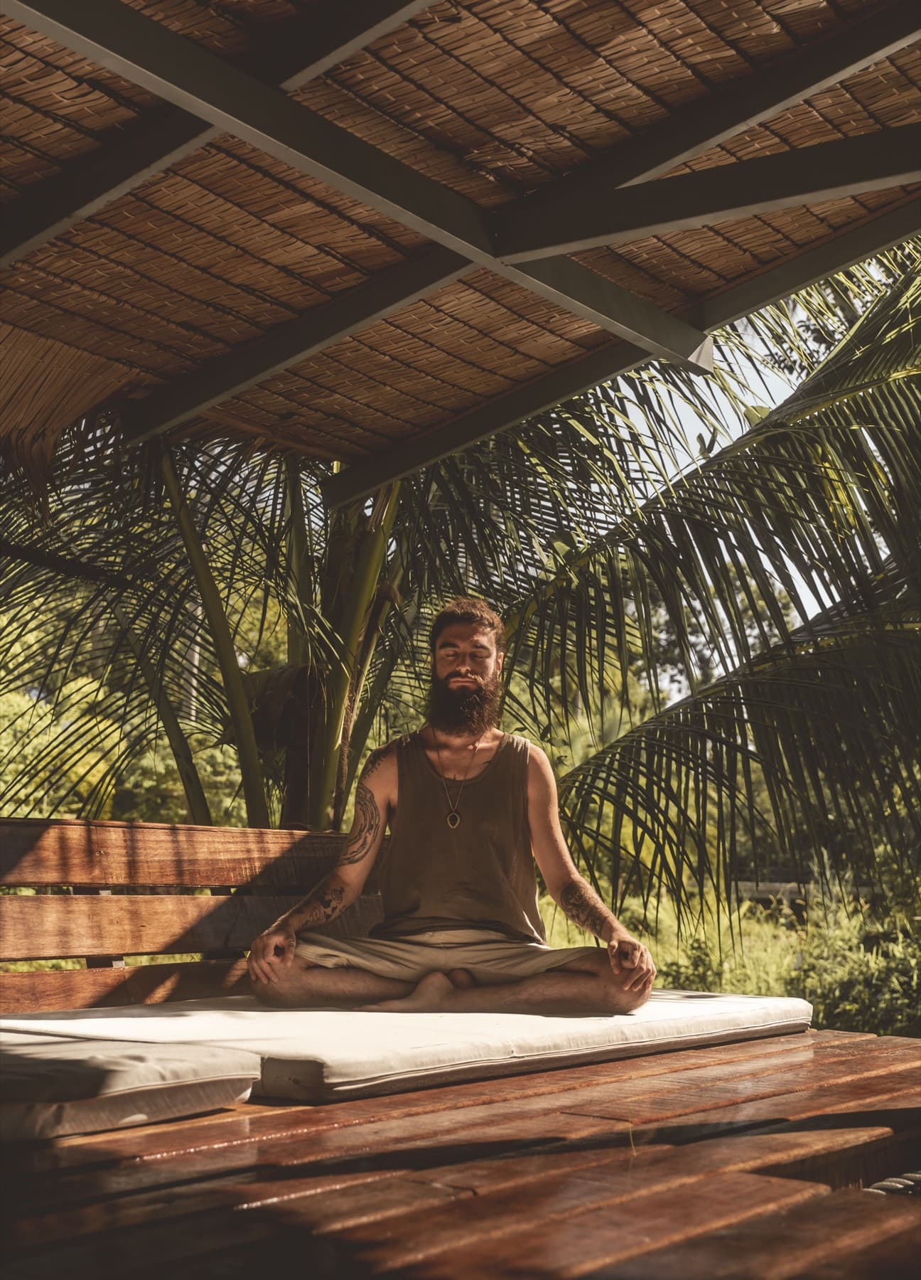 Guest meditating in the tropical garden at Wonderland